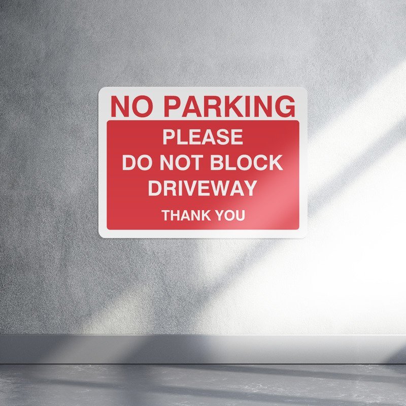 No parking please do not block driveway parking sign