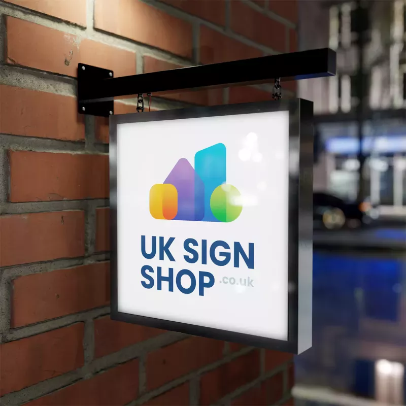 Illuminated LED shop sign lit up at night