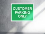 Green customer parking only sign - landscape