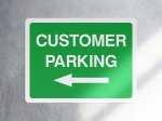 Green customer parking left arrow sign - landscape