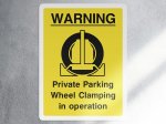 Warning private parking wheel clamping in operation security sign - portrait