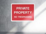 Private property no trespassing access sign - landscape