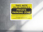You are parked in a private parking zone security sign