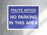 Polite notice no parking in this area parking sign