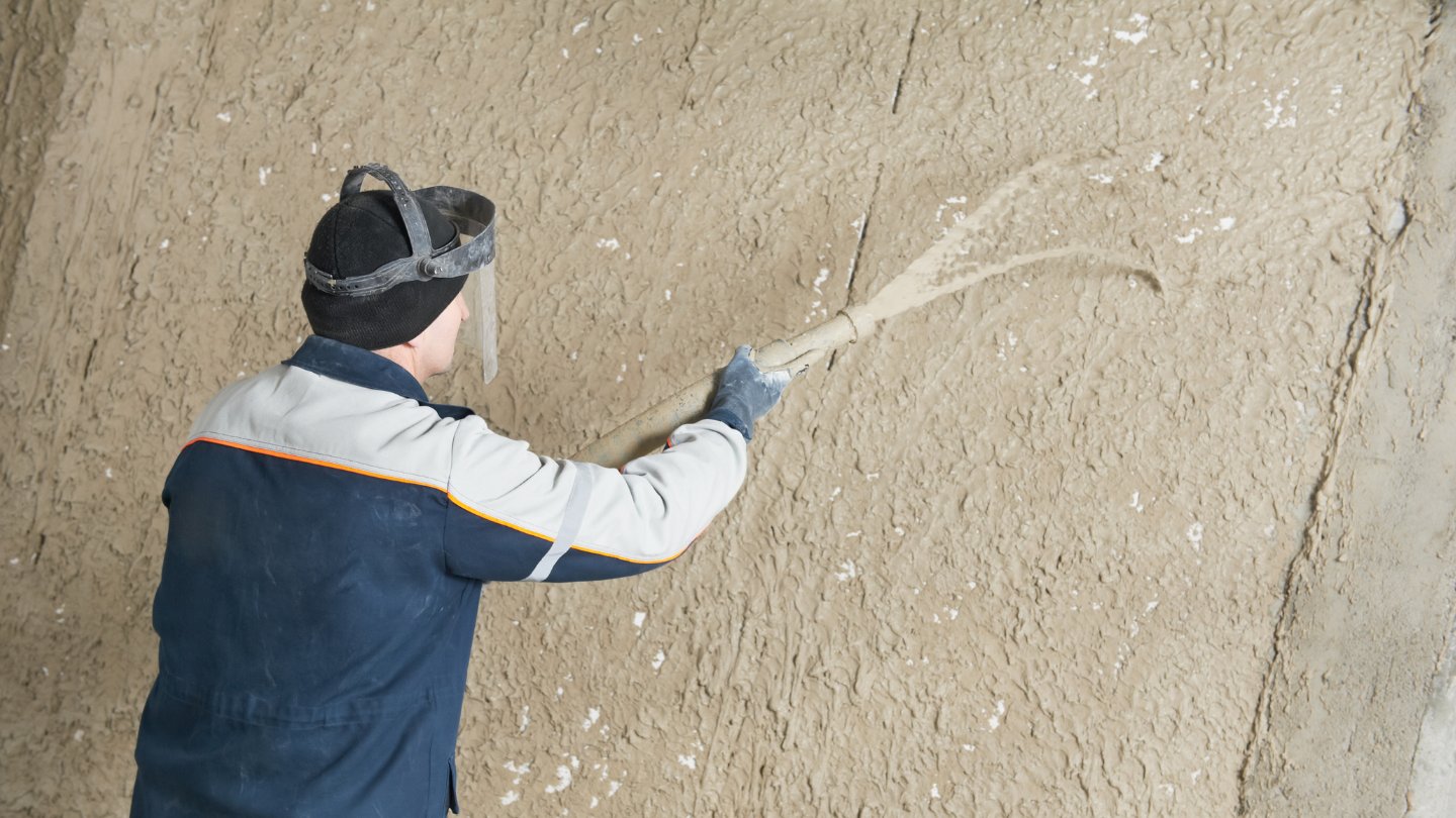 Using stucco to cover a brick wall